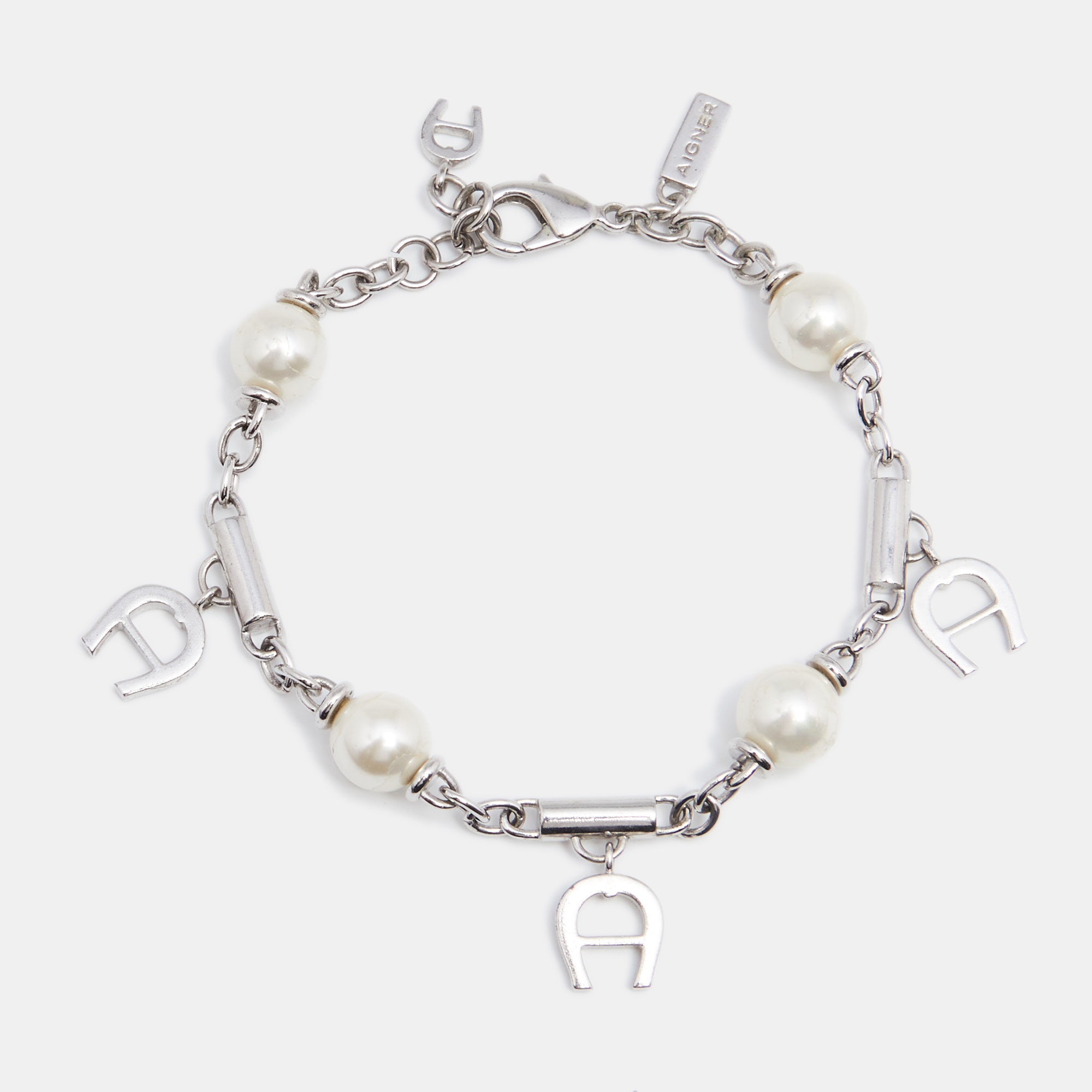 Aigner Silver Tone Logo Charms Pearl Station Bracelet